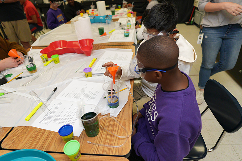 Students building reservoirs