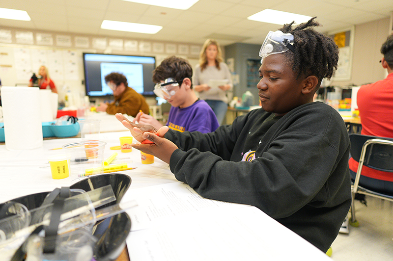 Students building reservoirs