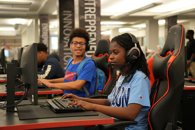 Students using a computer at STEM camp