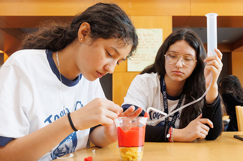 Students building reservoirs