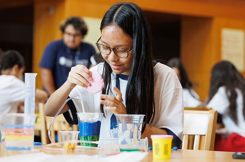 Students building reservoirs