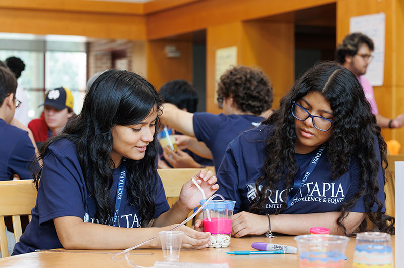 Students building reservoirs