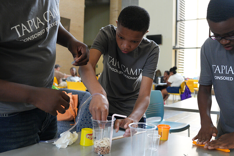 Students building reservoirs