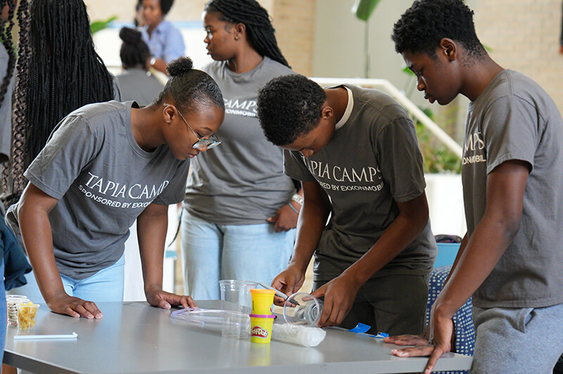 Students building reservoirs